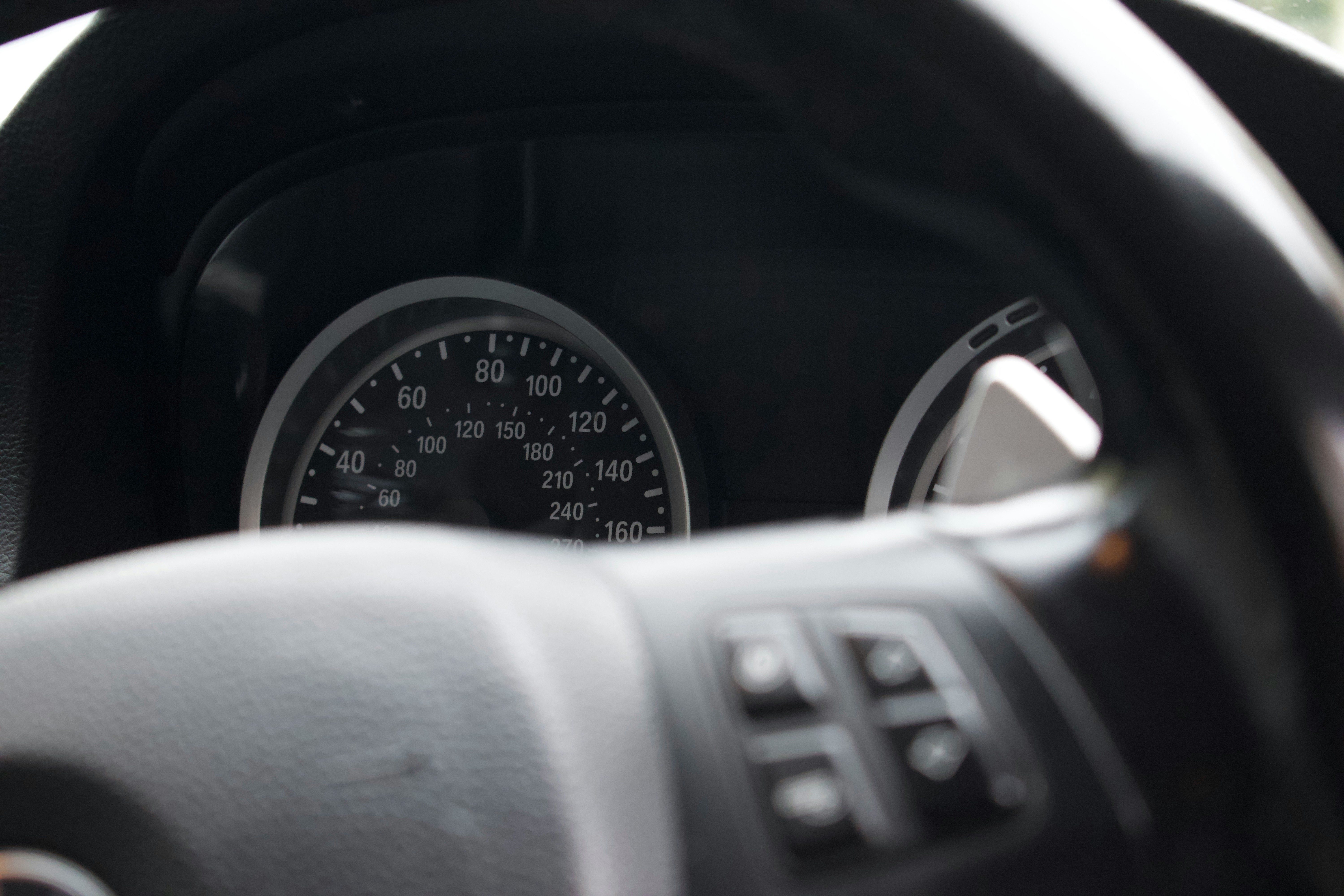 a close up of a car dashboard with a speedometer